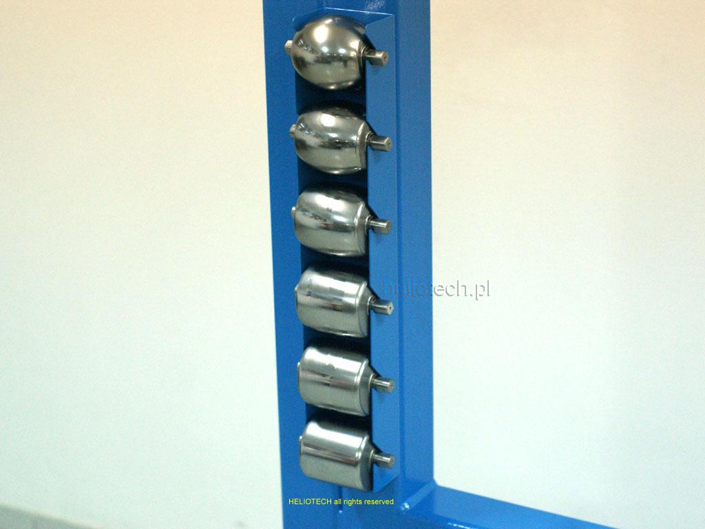 English wheel close-up of blue magazine with 6 pieces of steel lower rollers